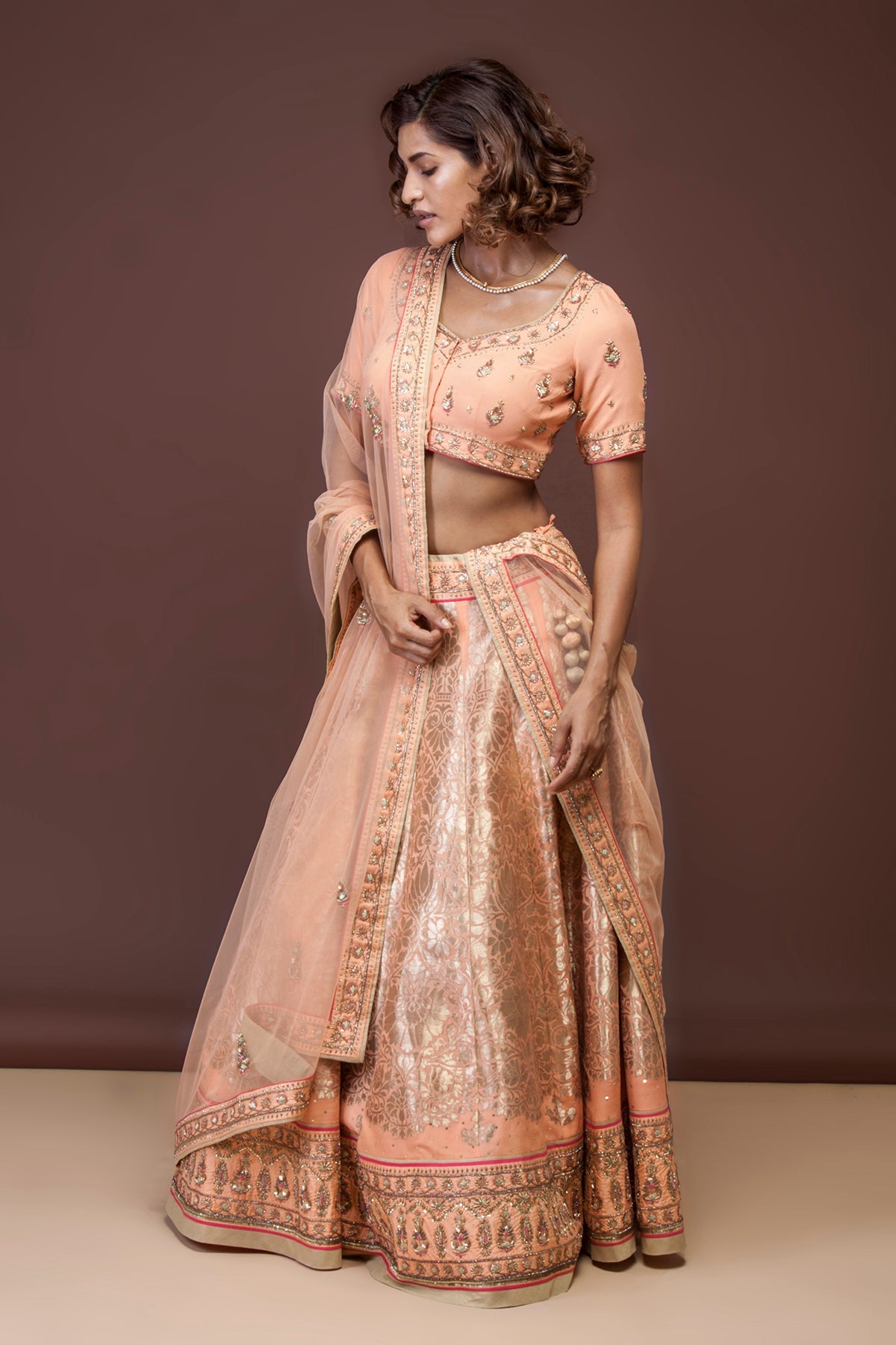 Handwoven and Embroidered Peach Georgette Lehenga